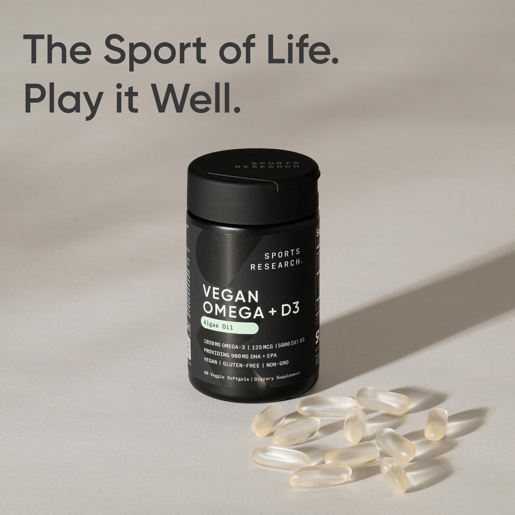 Sports Research omega-3 softgels shown with glass of water for daily routine.