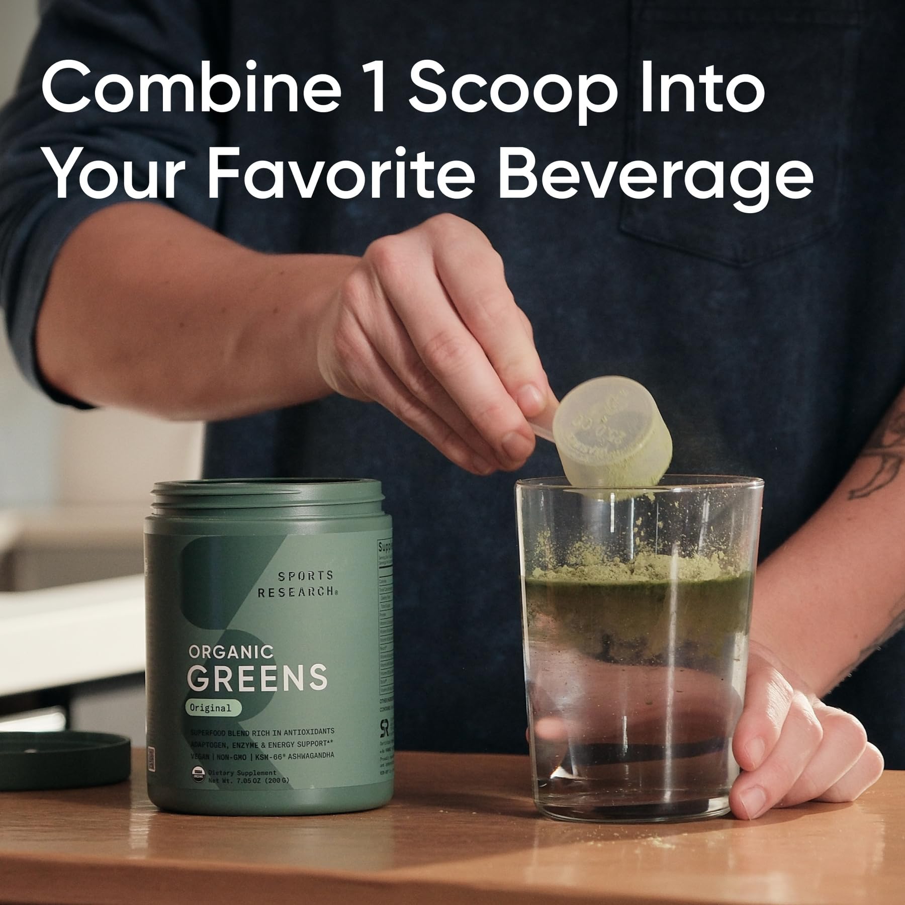 Sports Research Organic Greens Original powder dissolving in water for a refreshing morning routine.
