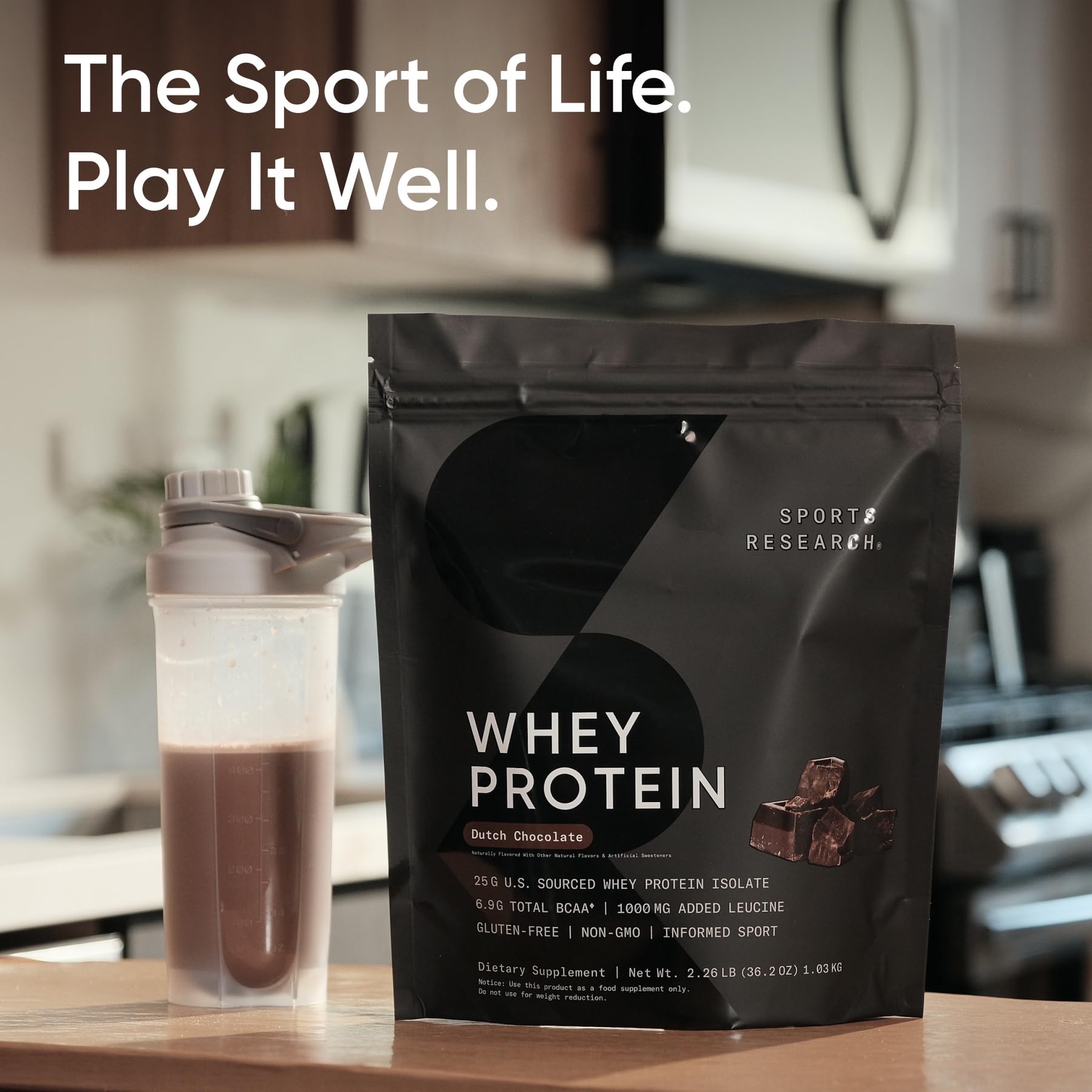 Sports Research whey protein packaging with scoop, emphasizing clean ingredients.