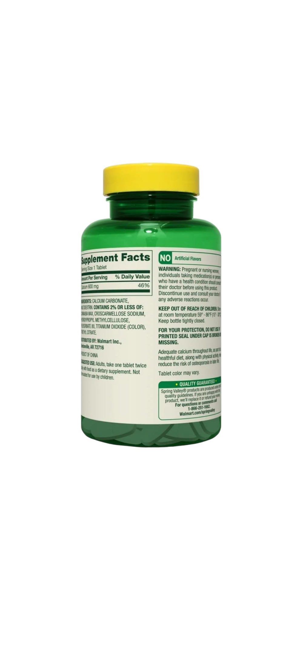 Spring Valley calcium bottle beside a glass of water for easy daily intake