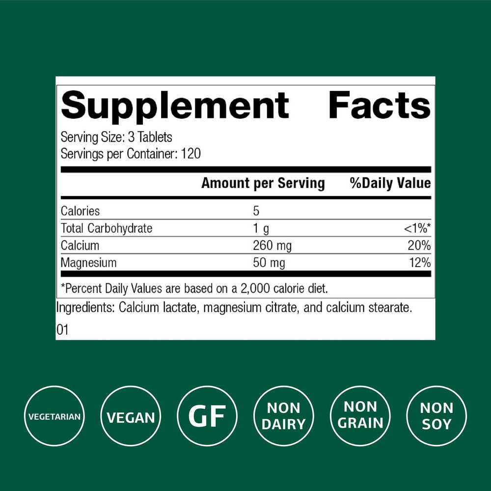 Standard Process Calcium Lactate tablet closeup highlighting compact vegan formula.