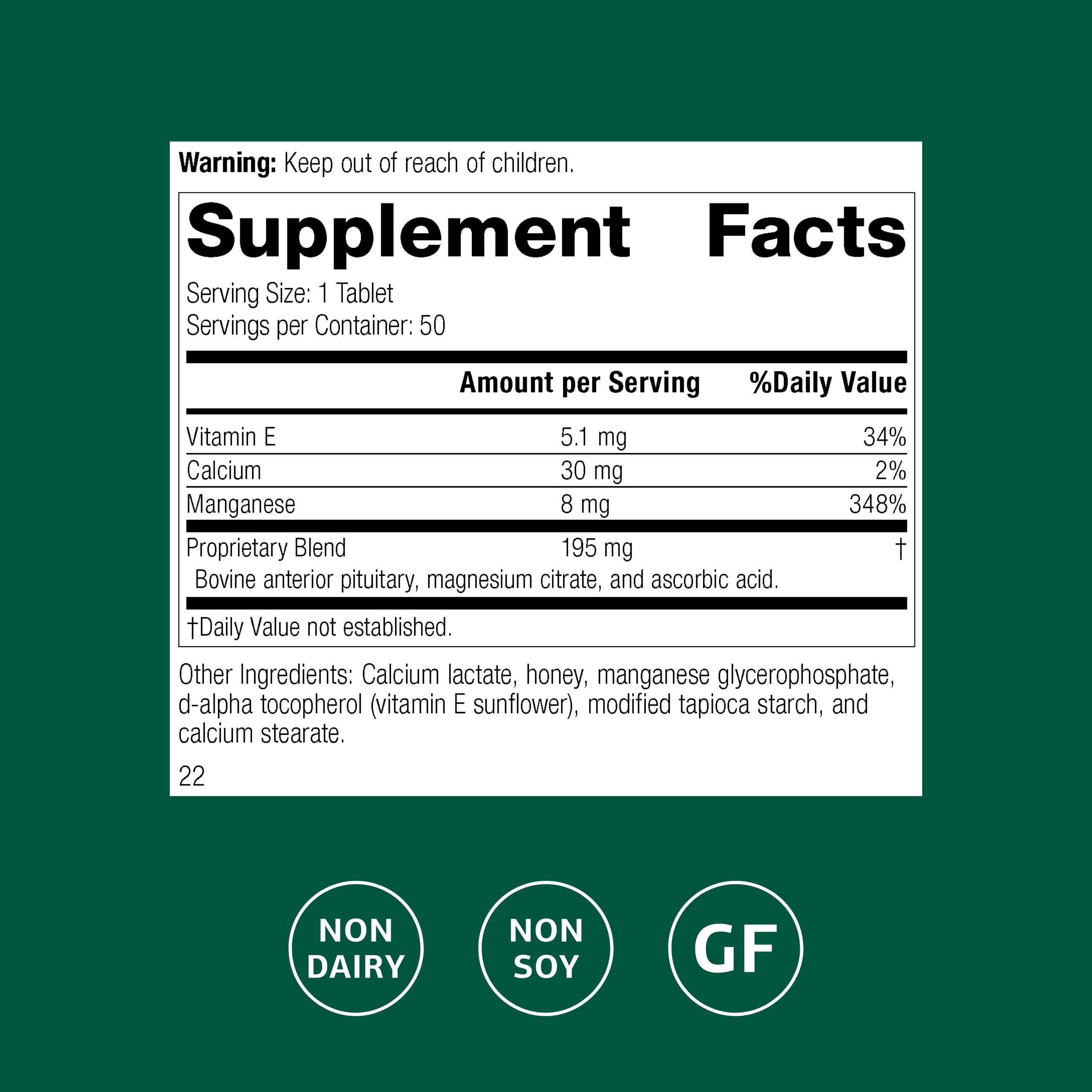 Close-up of Standard Process E-Manganese tablet highlighting manganese and vitamin E.