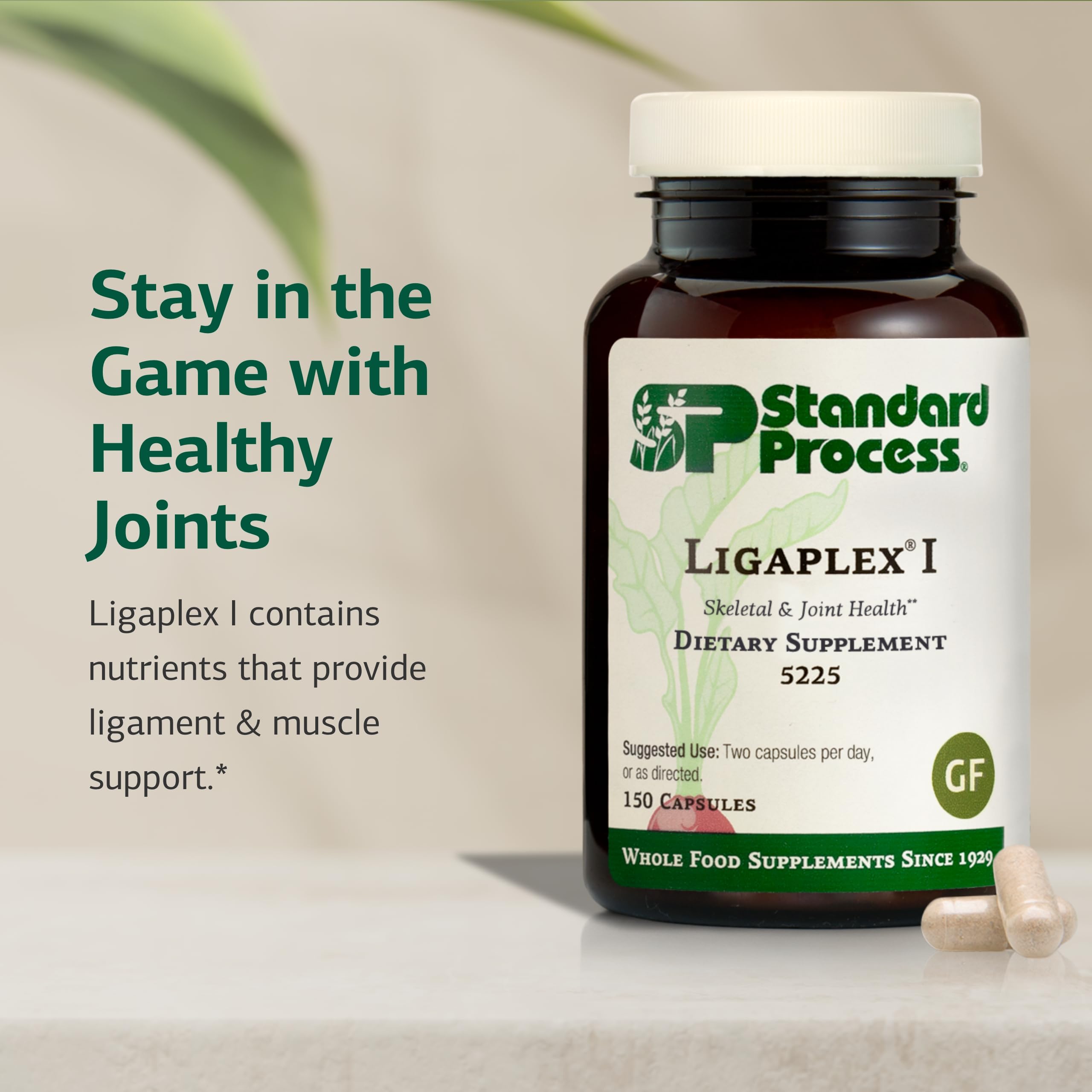 Standard Process Ligaplex I bottle pour image showing easy daily capsule intake.