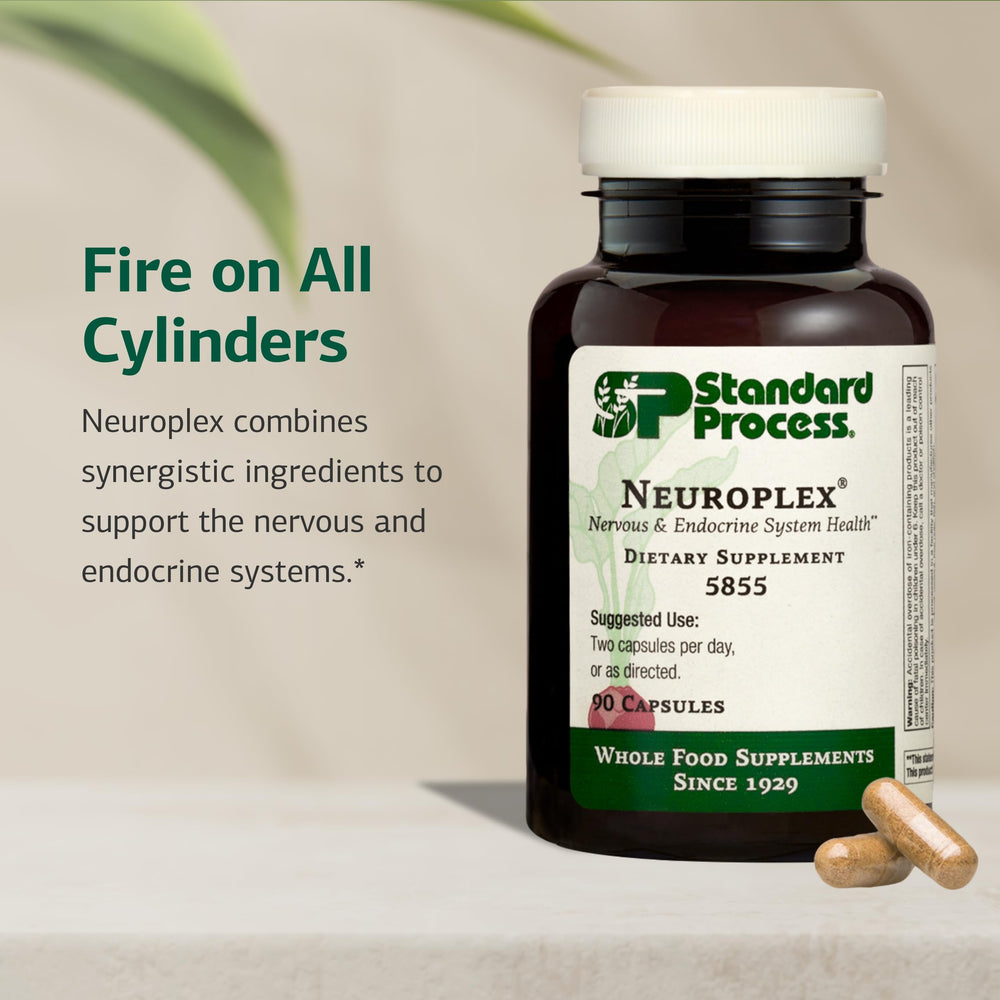 Standard Process Neuroplex capsules outside container for easy dosing