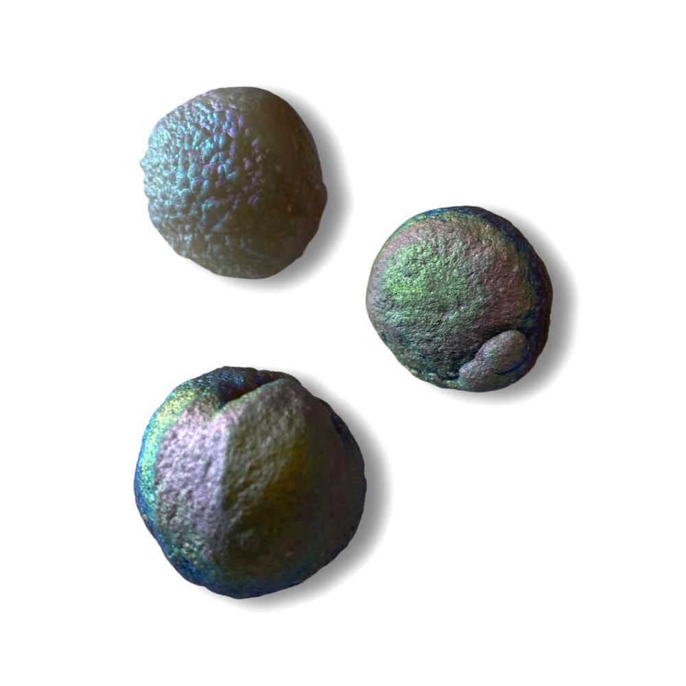 Starborn Rainbow Chalcedony Unicorn Poop under light reveals butterfly-wing iridescence