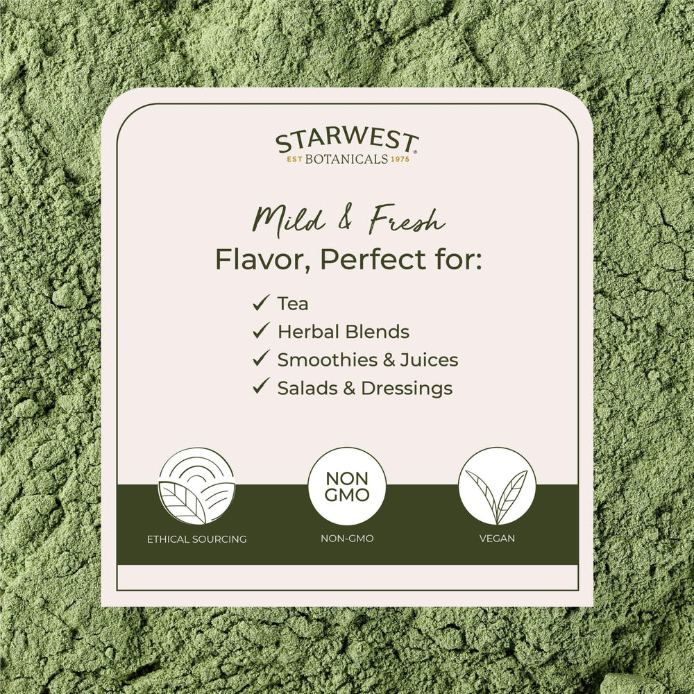 Wheatgrass powder poured into juice for a nutrient-rich drink
