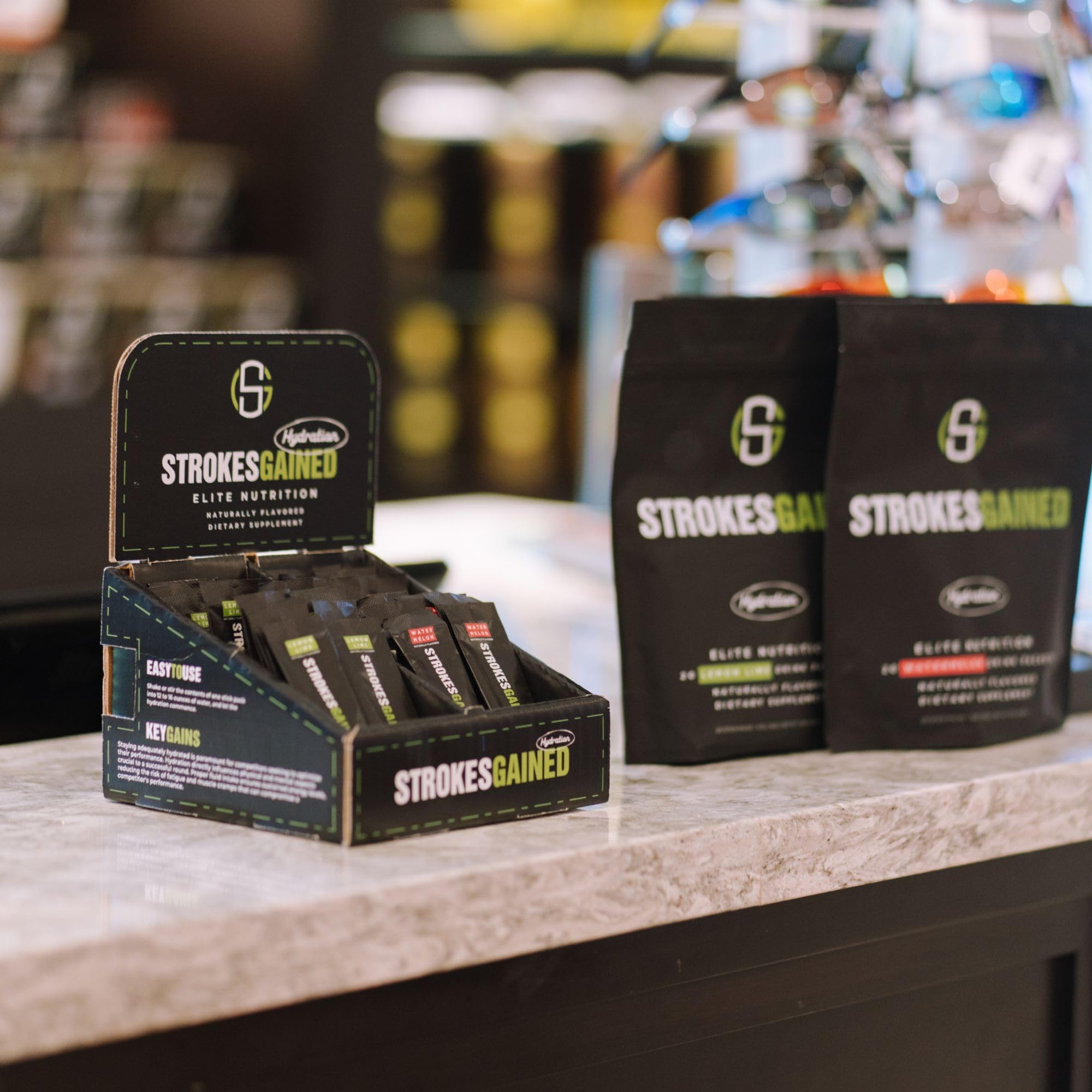 Strokes Gained Hydration orange stick pack gift for golf enthusiasts.