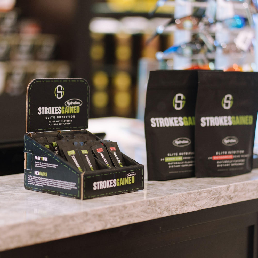 Strokes Gained Hydration orange stick pack gift for golf enthusiasts.
