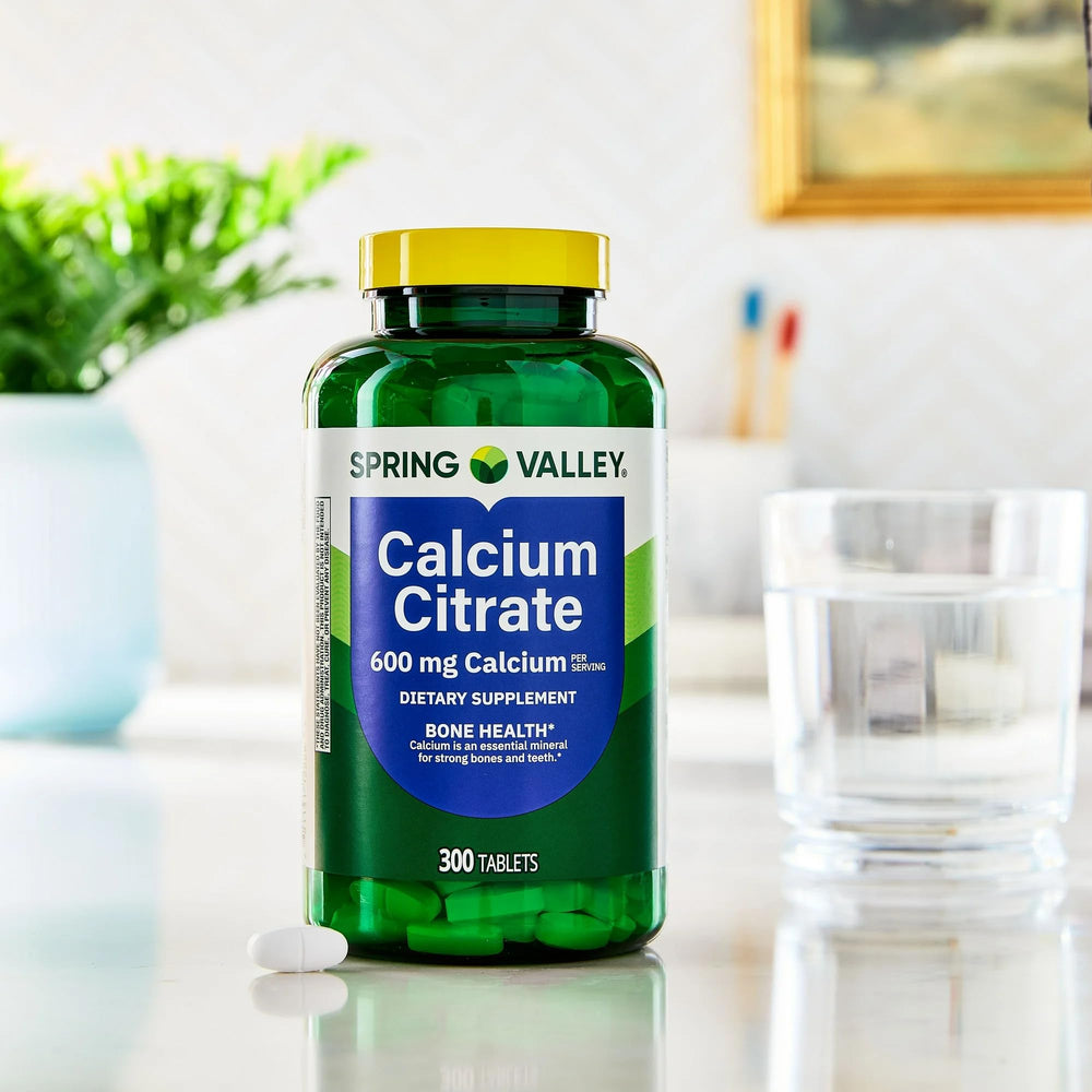 STS Home calcium citrate packaging beside a nutritious meal for daily use
