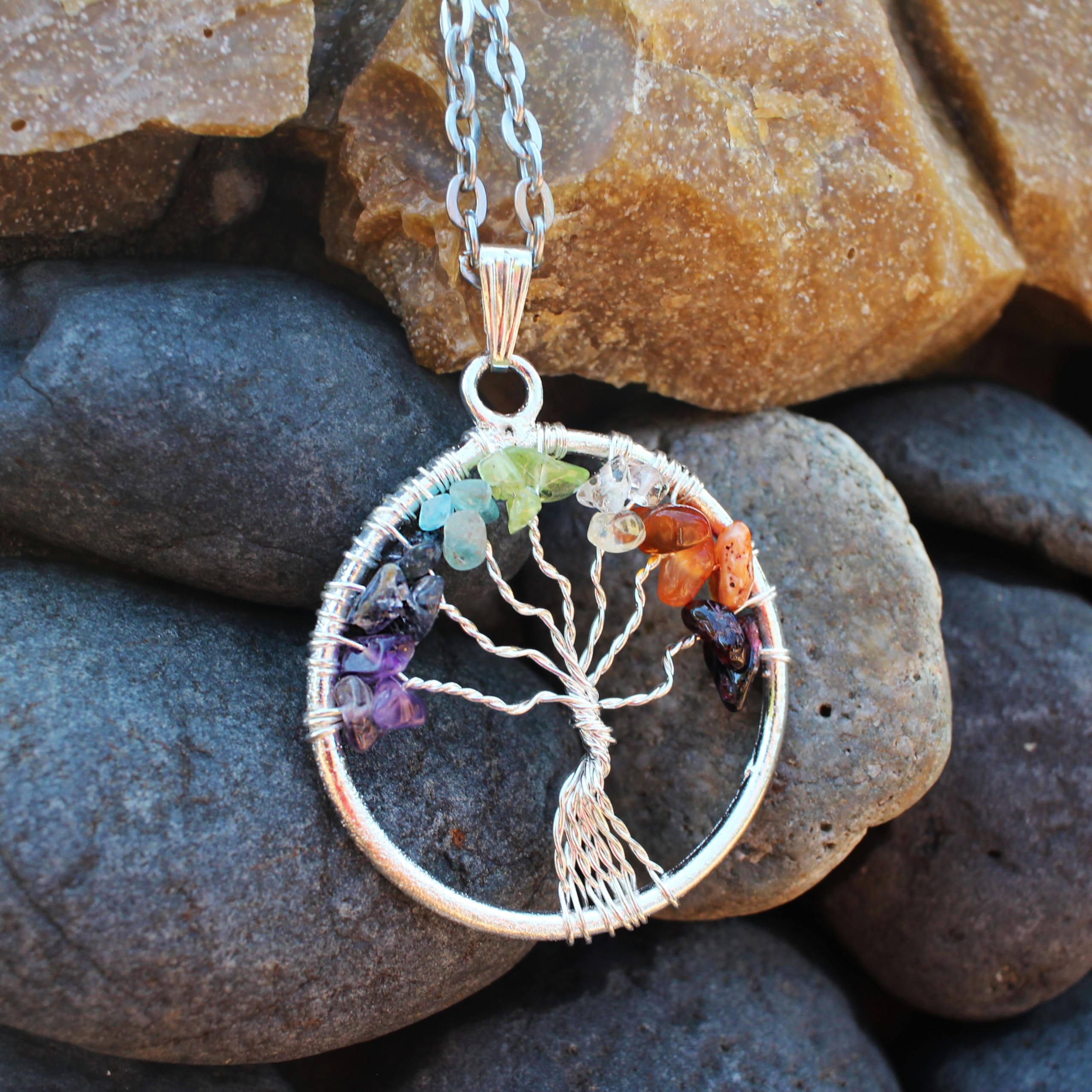 Sugandha Wellness Tree of Life pendant close-up showing crystal leaves and craftsmanship.