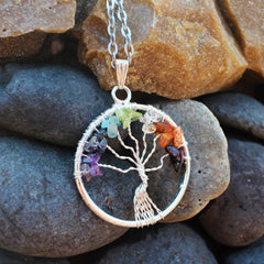 Sugandha Wellness Tree of Life pendant close-up showing crystal leaves and craftsmanship.