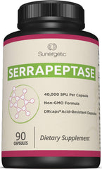 Sunergetic Serrapeptase bottle on table, may support overall wellness with enzyme benefits.
