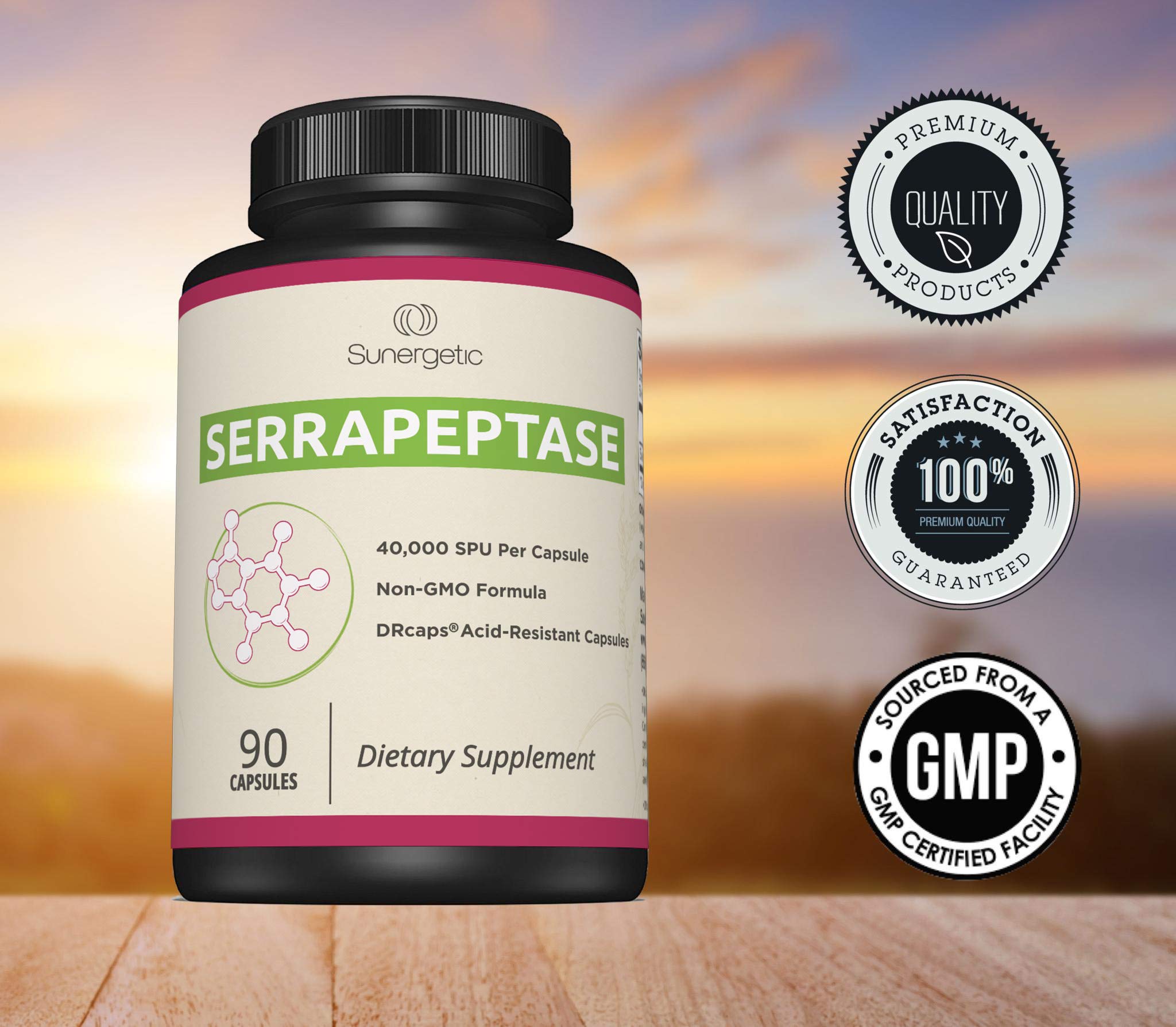 Sunergetic Serrapeptase capsules in hand for convenient daily use.