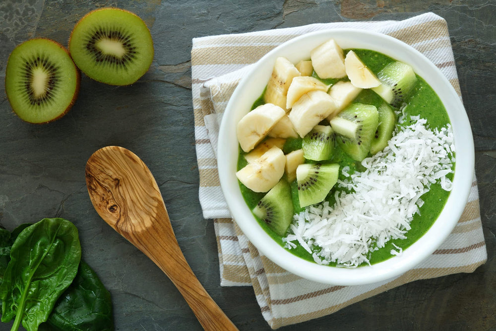 Sunfood Supergreens & Protein glass with smoothie, enhances energy during workouts.