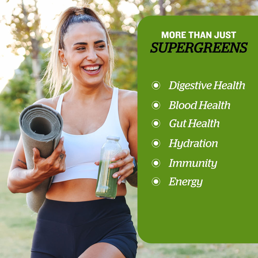 Sunfood Supergreens being stirred into water for a nutrient-rich drink.