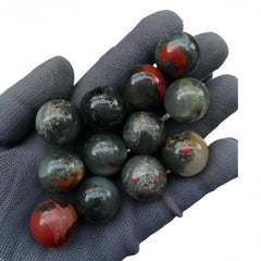 Sunshcat African Bloodstone balls used in decorative grids for calm ambience.