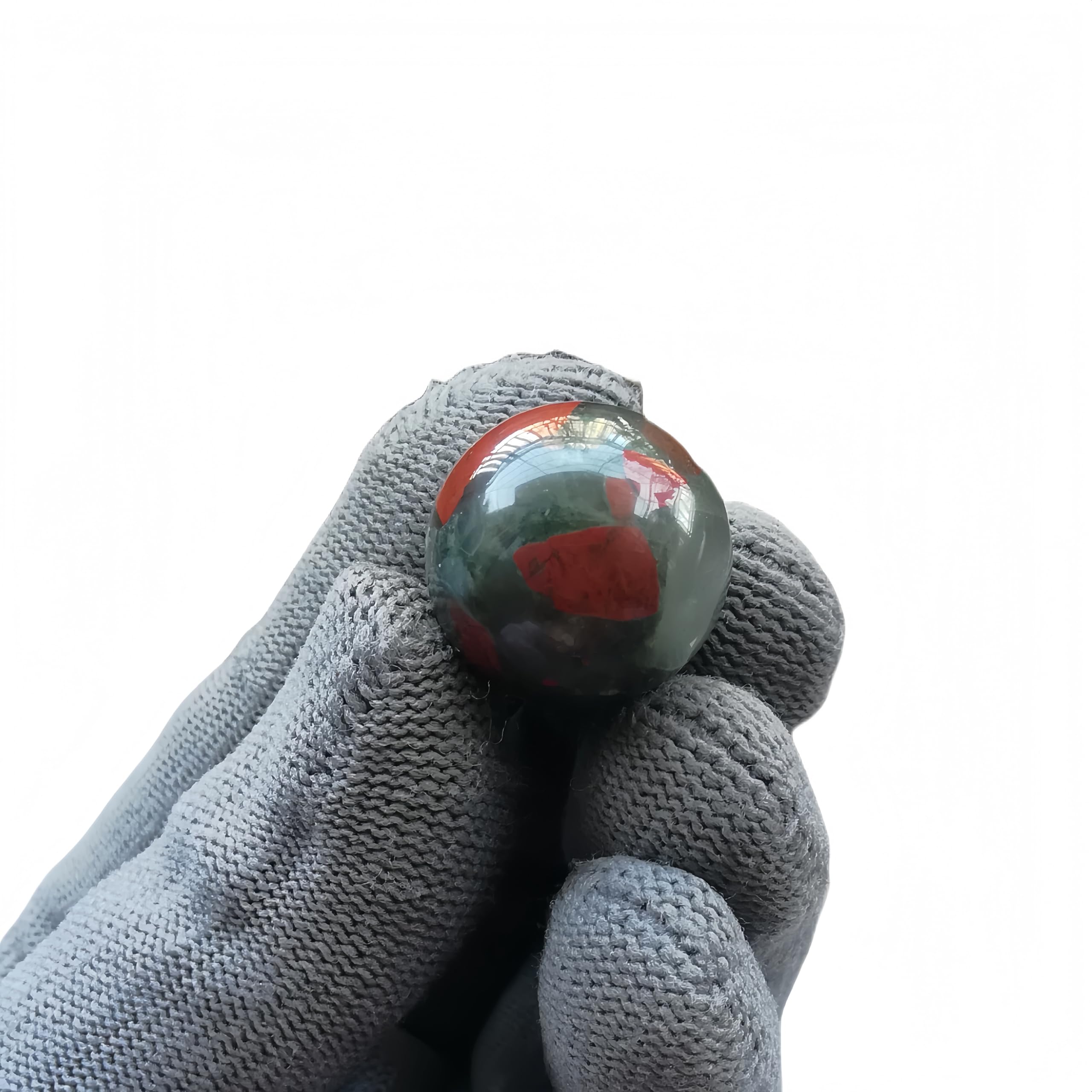 Sunshcat African Bloodstone ball set of seven arranged for decorative display.