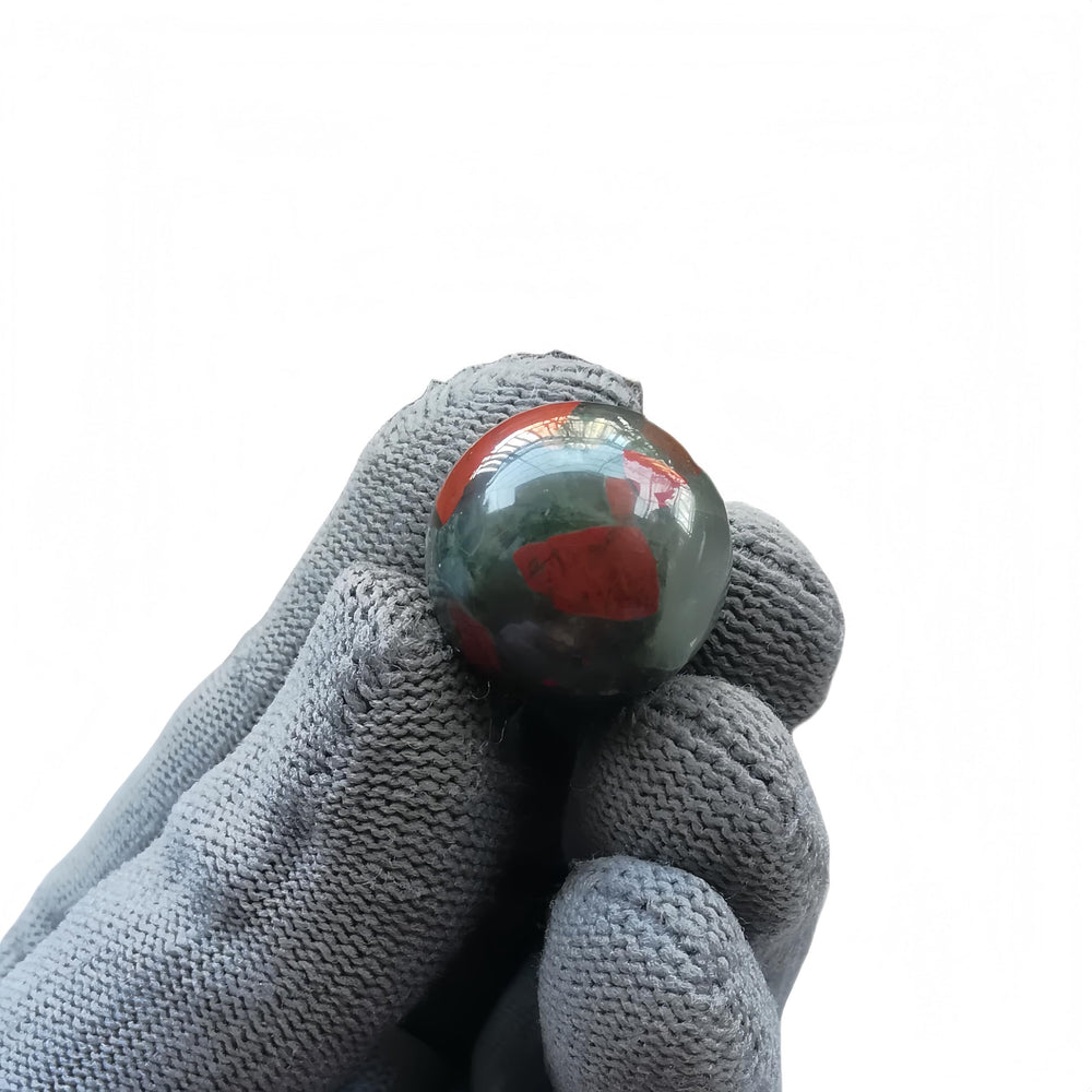 Sunshcat African Bloodstone ball set of seven arranged for decorative display.