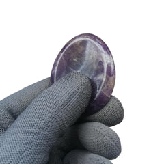 Sunshcat amethyst palm stone fits between fingers for calming moments.
