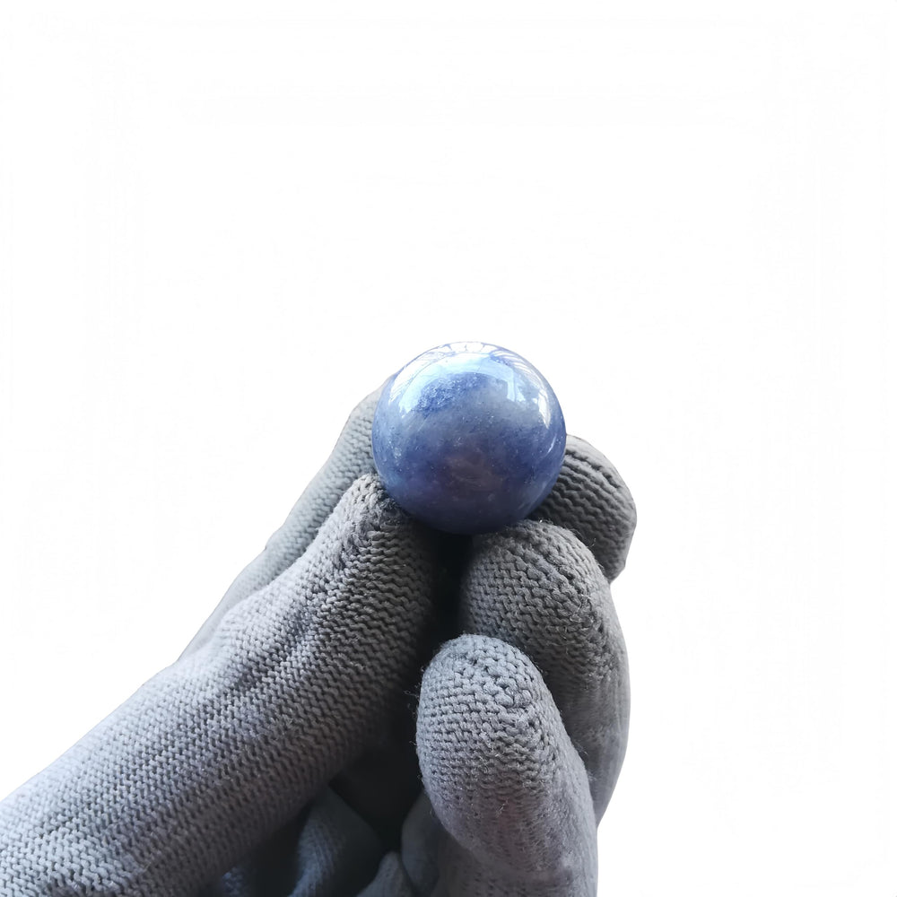 Close-up of Sunshcat blue aventurine ball showing natural color variation.