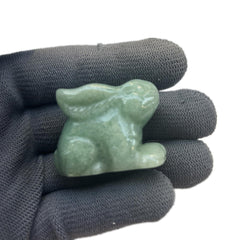 Sunshcat green aventurine rabbit crystal statue highlighting natural color variation.