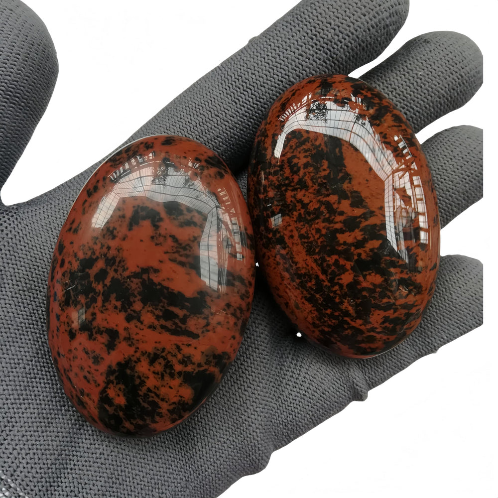 Sunshcat healing crystal palm stone used in relaxing energy therapy sessions