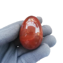 Sunshcat Carnelian Egg close-up highlighting vibrant color for energy.