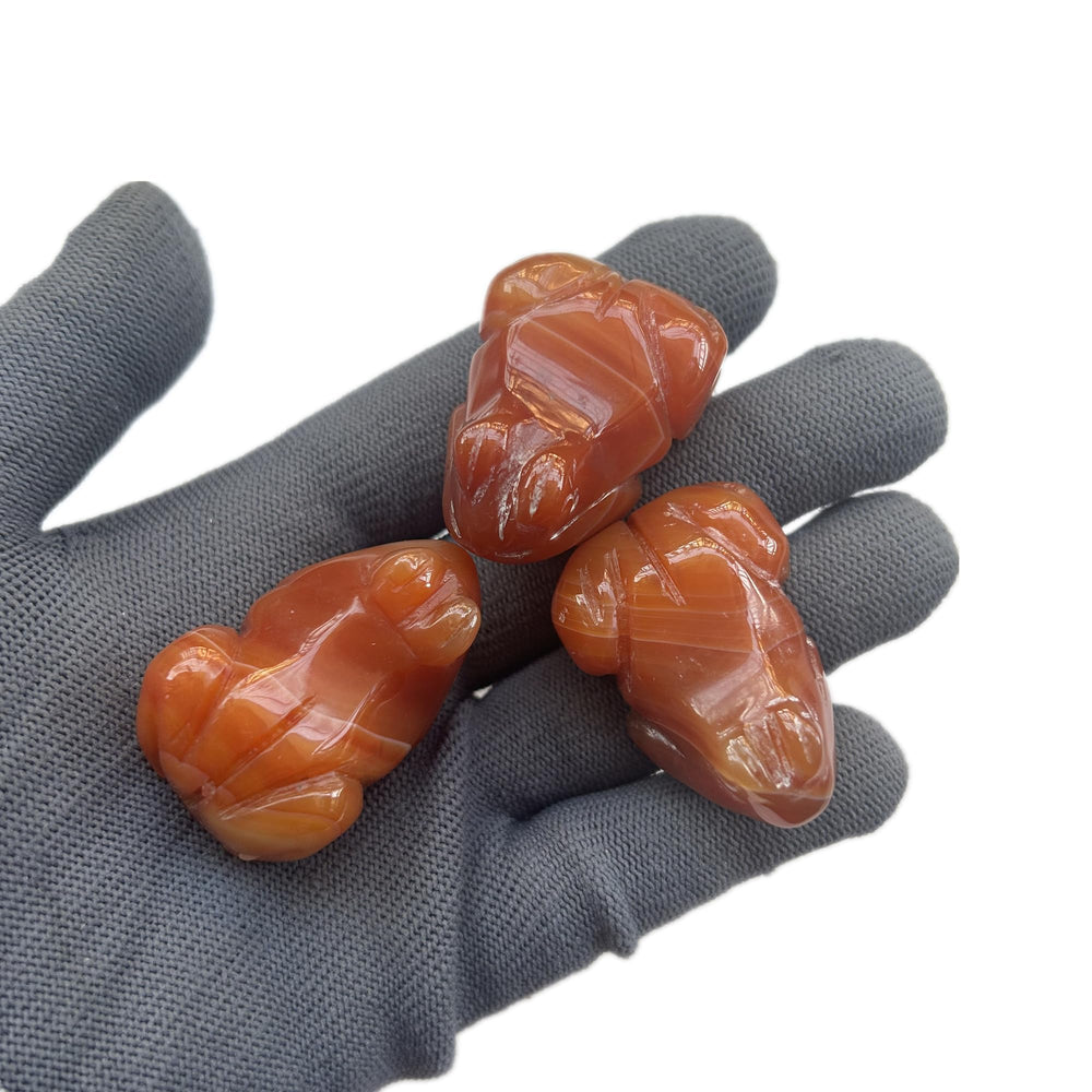 Sunshcat natural crystal frog sculpture highlighting hand carving for display.