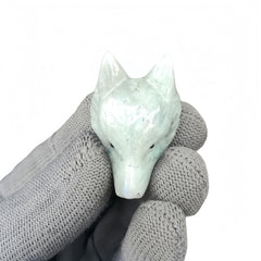 Sunshcat Moonstone Wolf Head Figurine on display highlights calming color and subtle shine.