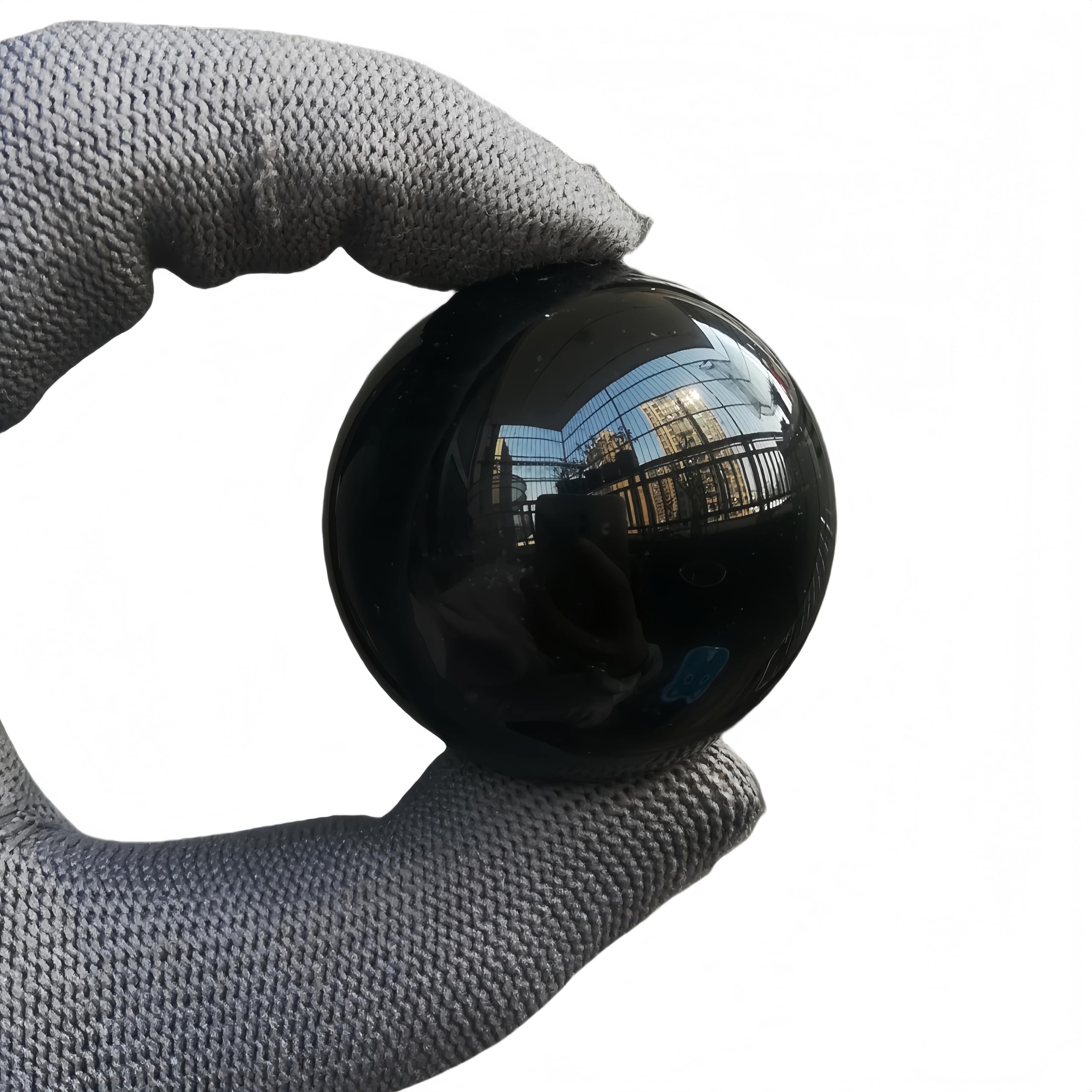 Sunshcat obsidian sphere closeup showing natural patterns for meditation