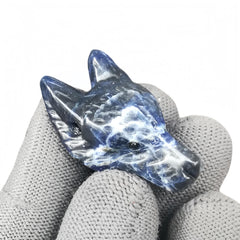 Sunshcat sodalite wolf head figurine, a pocket crystal promoting calm energy and focus.