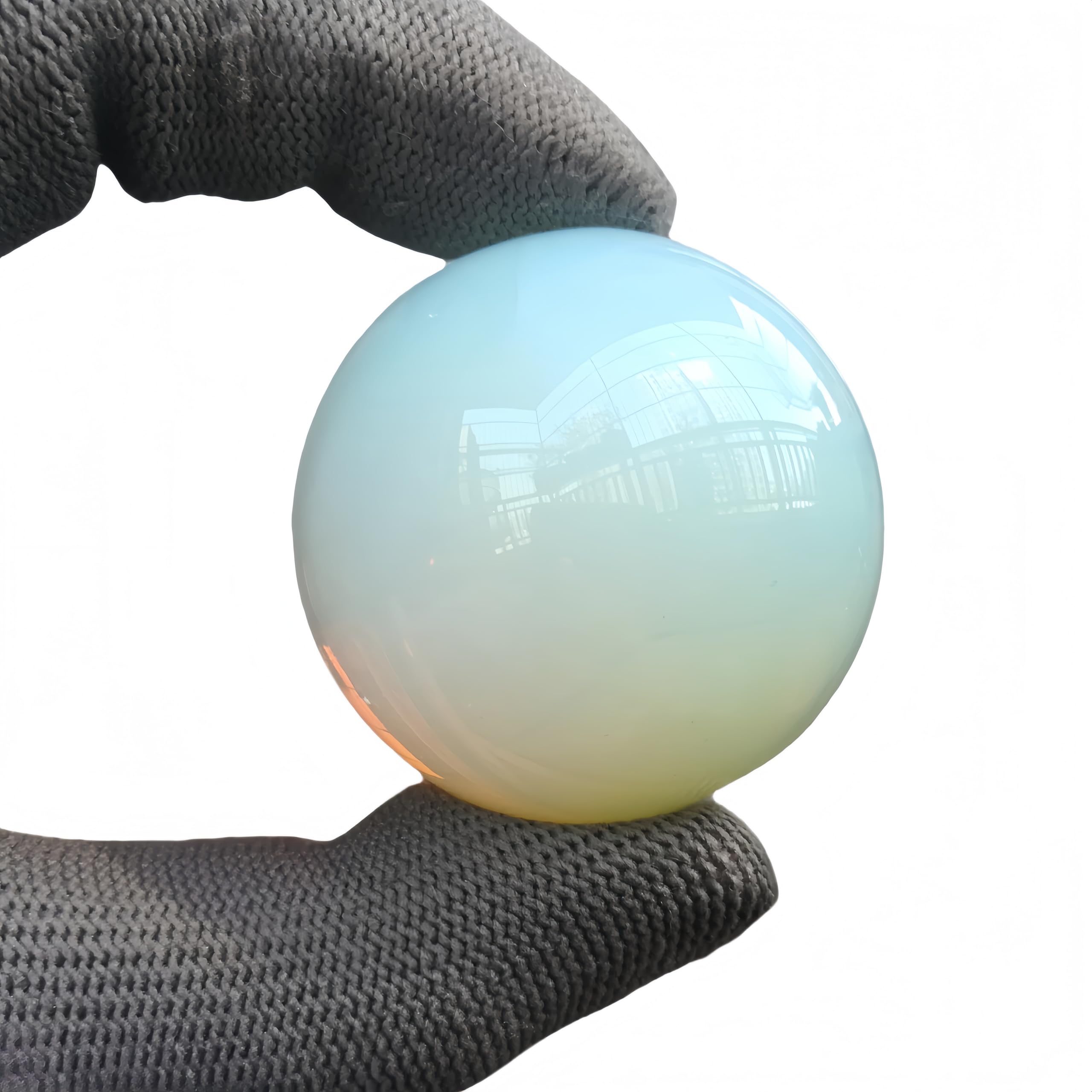Sunshcat Opalite ball in serene desk setup for Feng Shui energy.