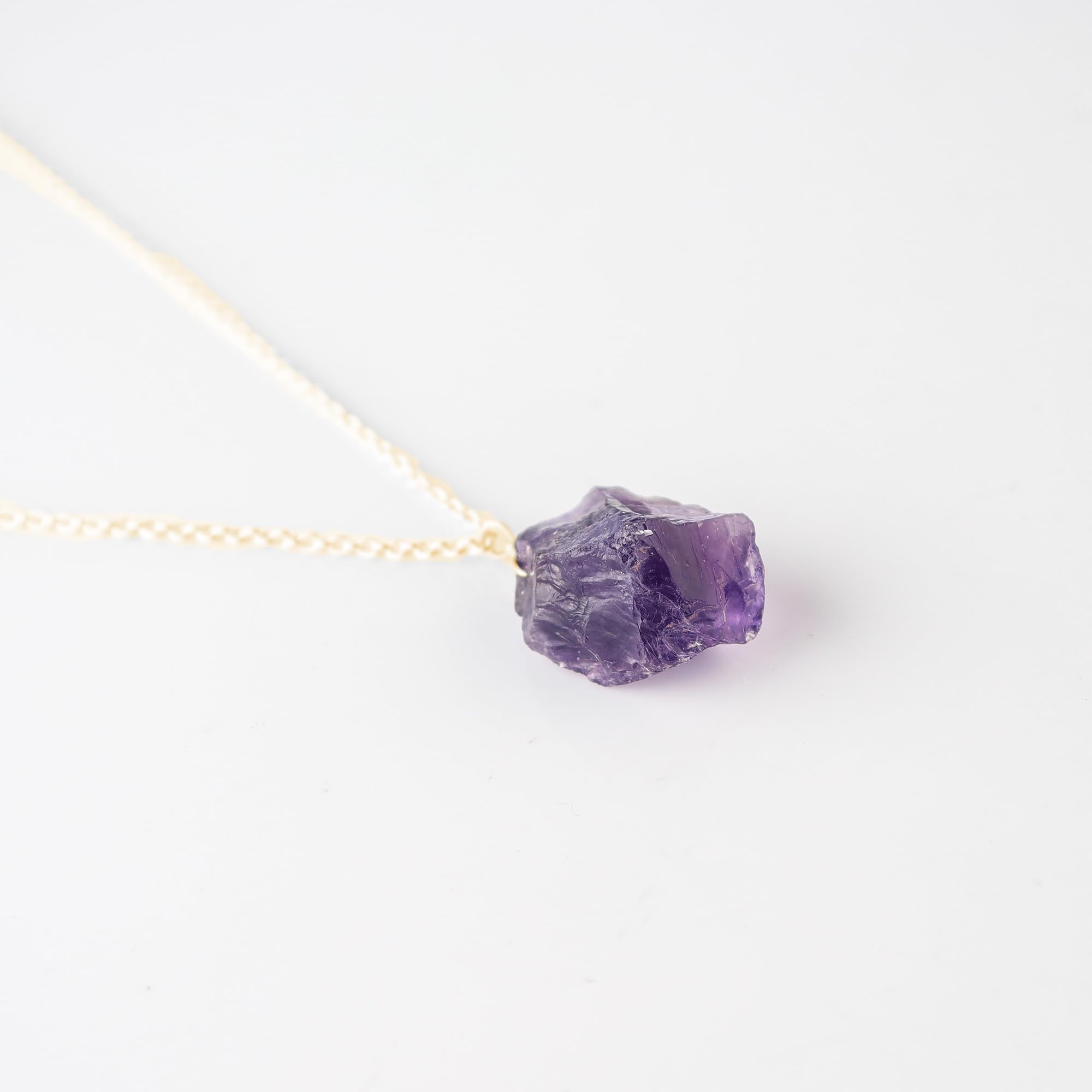 Sunshinegems amethyst crystal closeup showing natural violet hues for a unique gemstone look.