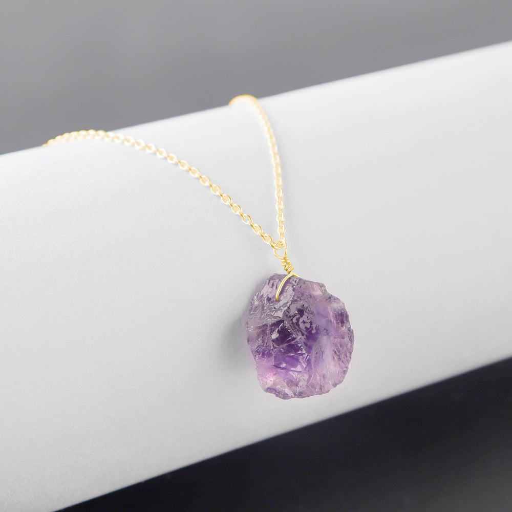 Sunshinegems raw amethyst pendant detail highlights natural facets and artisan texture.
