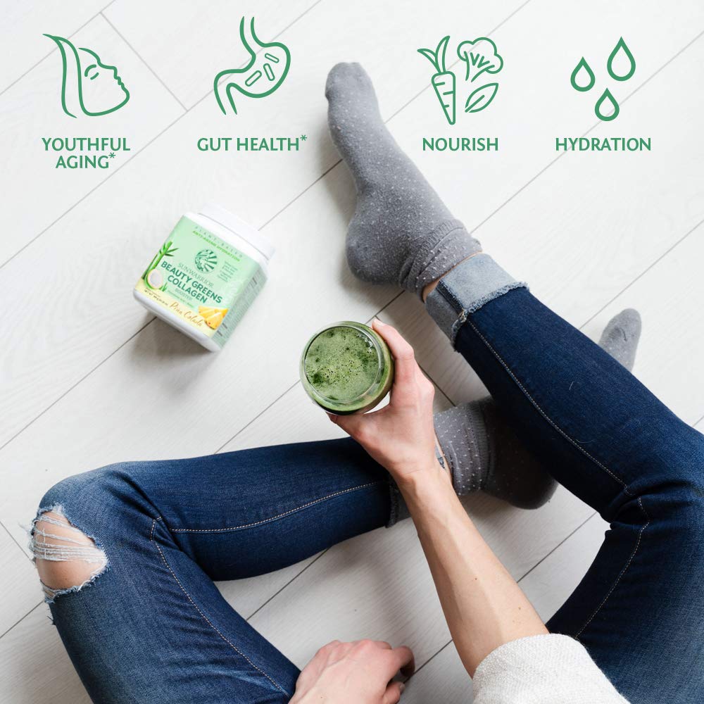 Sunwarrior Beauty Greens Drink scoop ready to mix with water.