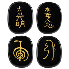 SUNYIK flat oval black agate palm stone with engraved Usui symbols for meditation and grounding.