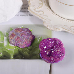 SUNYIK crystal geode with purple AB coating gleams under light