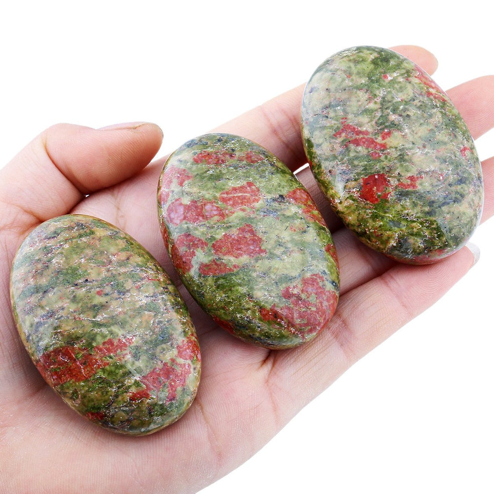 SUNYIK Unakite oval palm stone showcasing orange, red, white patterns for energy work.