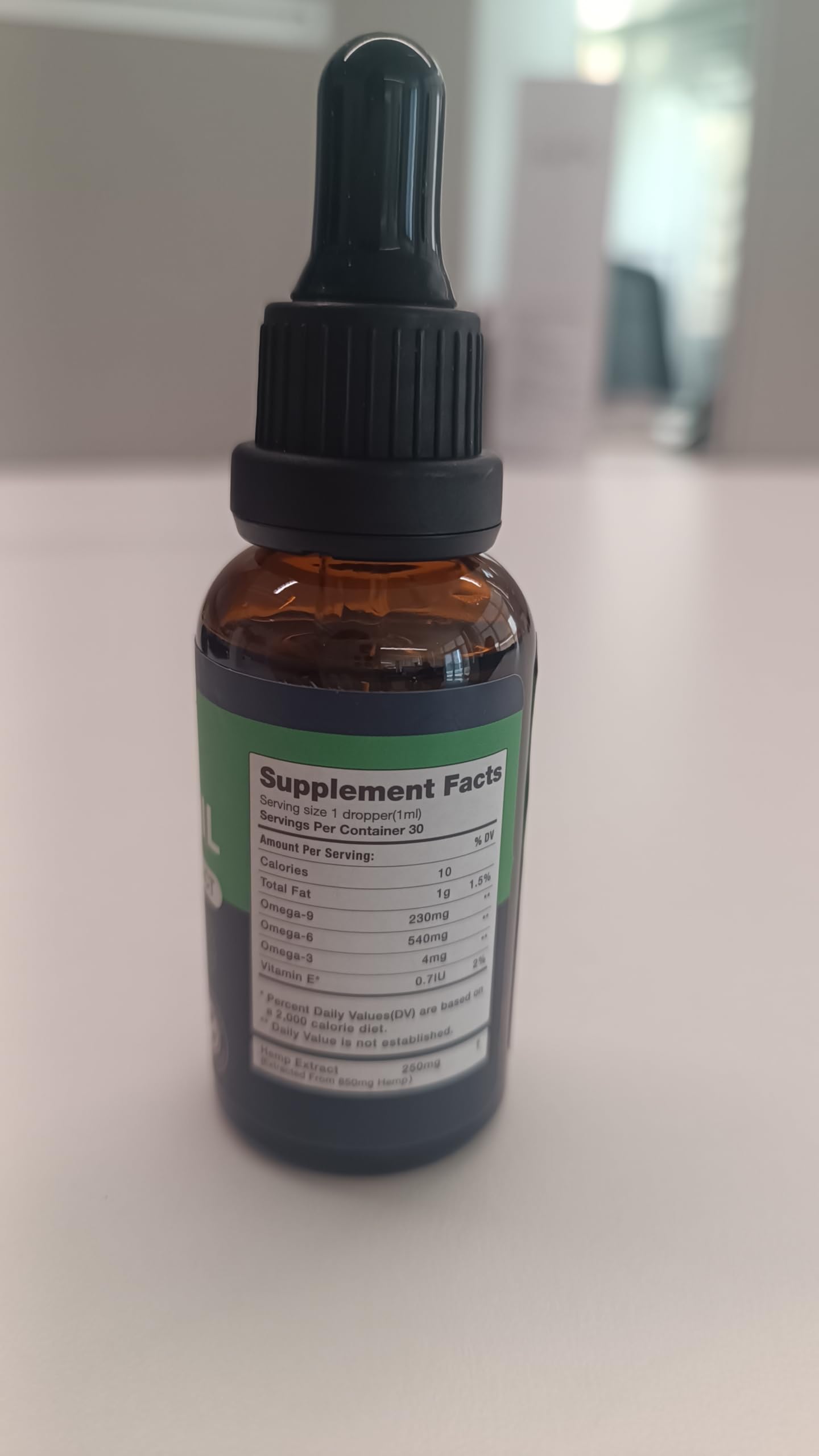 SUOOCH hemp oil drops label close-up shows purity and strength.
