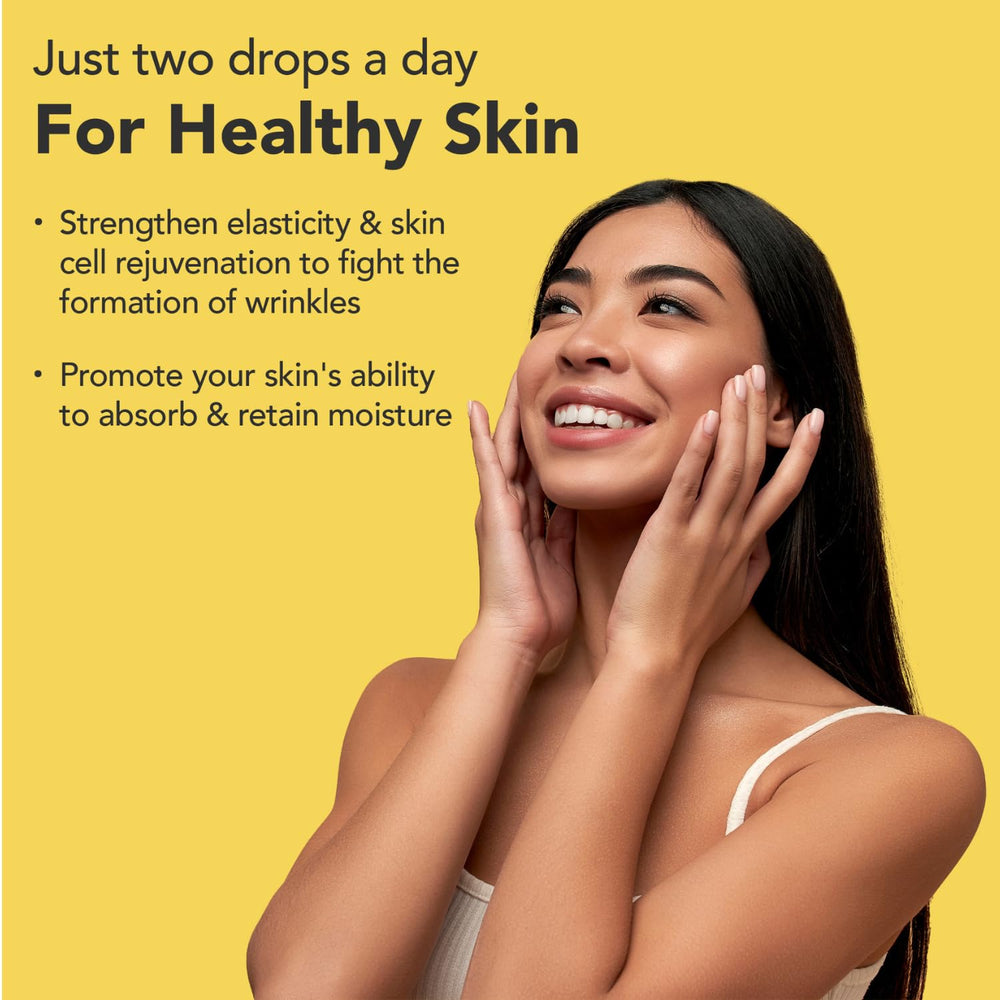 Super Natural Goods liquid biotin-collagen dropper shows easy daily dosing for hair health.