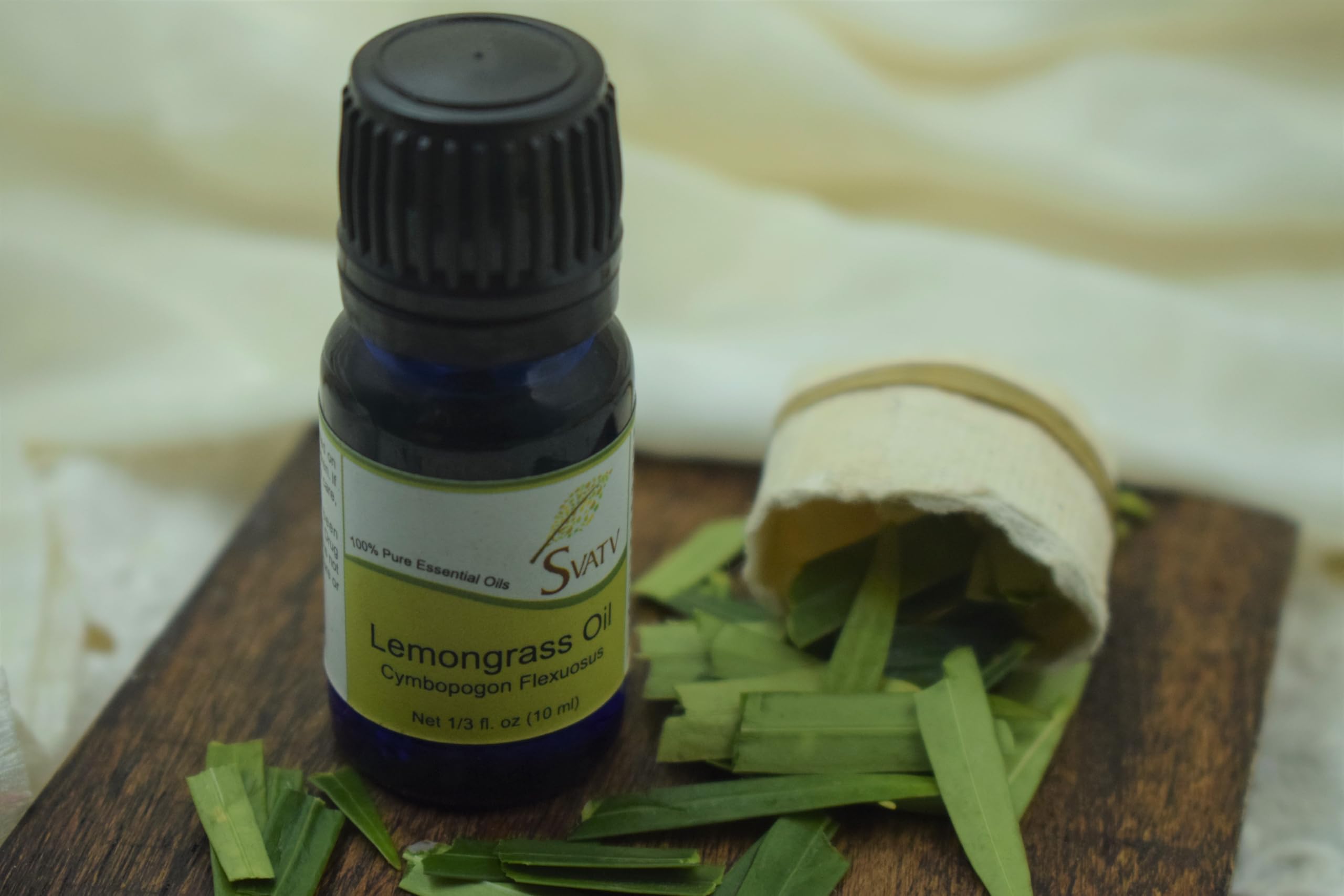 SVATV lemongrass essential oil bottle label indicates purity.