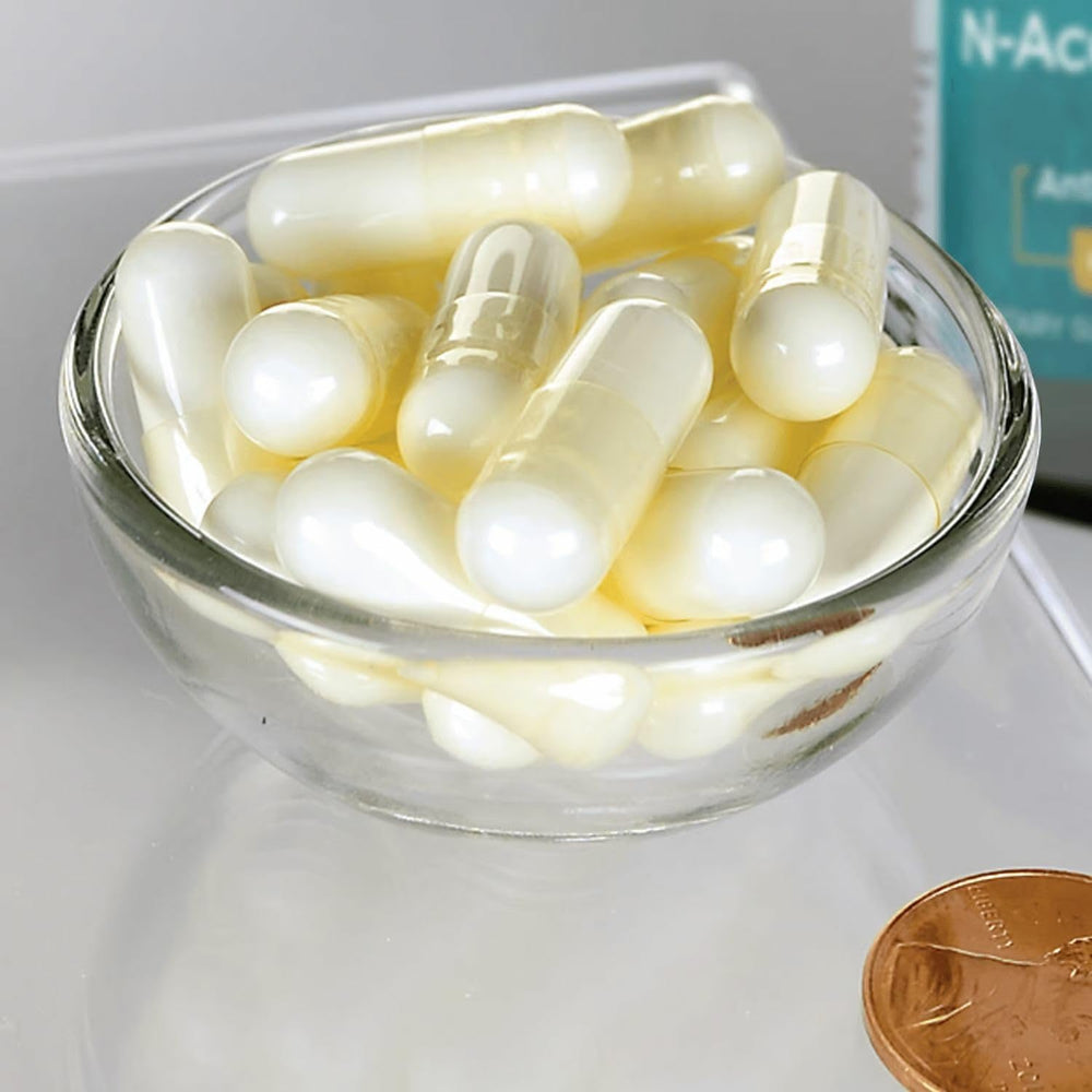 Swanson NAC capsules poured for easy daily dosing and routine.