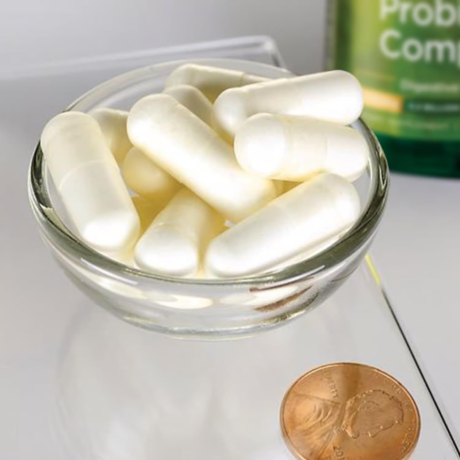 Swanson Probiotic Complex capsules close-up emphasizing 4.2B CFU strain blend.