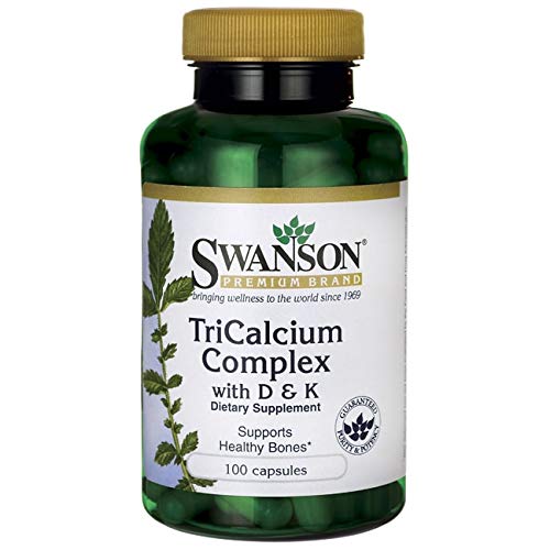 Swanson Tricalcium Complex capsules dispensed, ready for daily calcium intake.