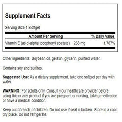 Swanson Vitamin E 400 IU softgels poured from bottle for easy intake