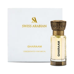 Swiss Arabian Gharaam bottle pouring scene showing long-lasting fragrance.