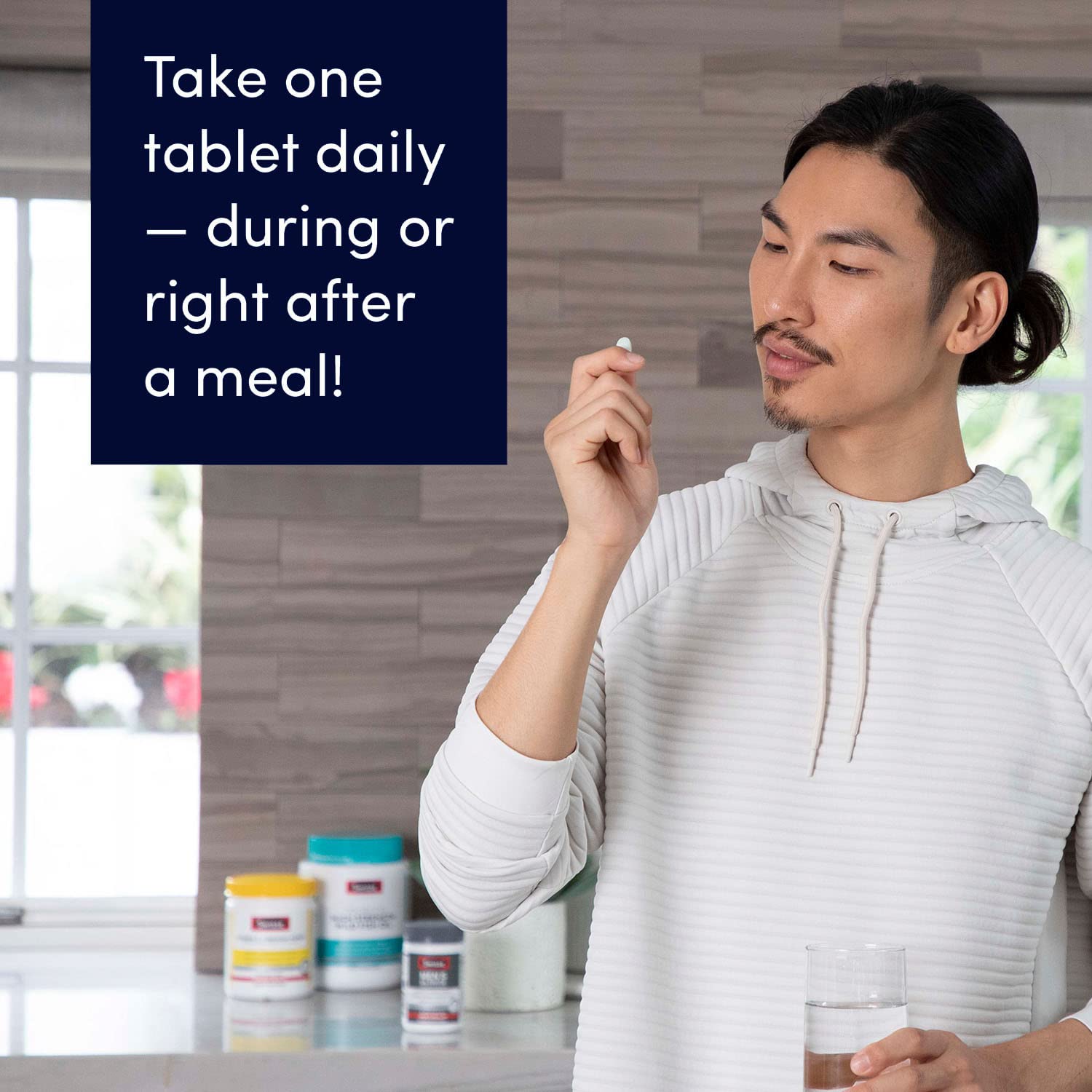 Swisse Ultivite Men’s bottle on kitchen counter suggests daily wellness ritual.