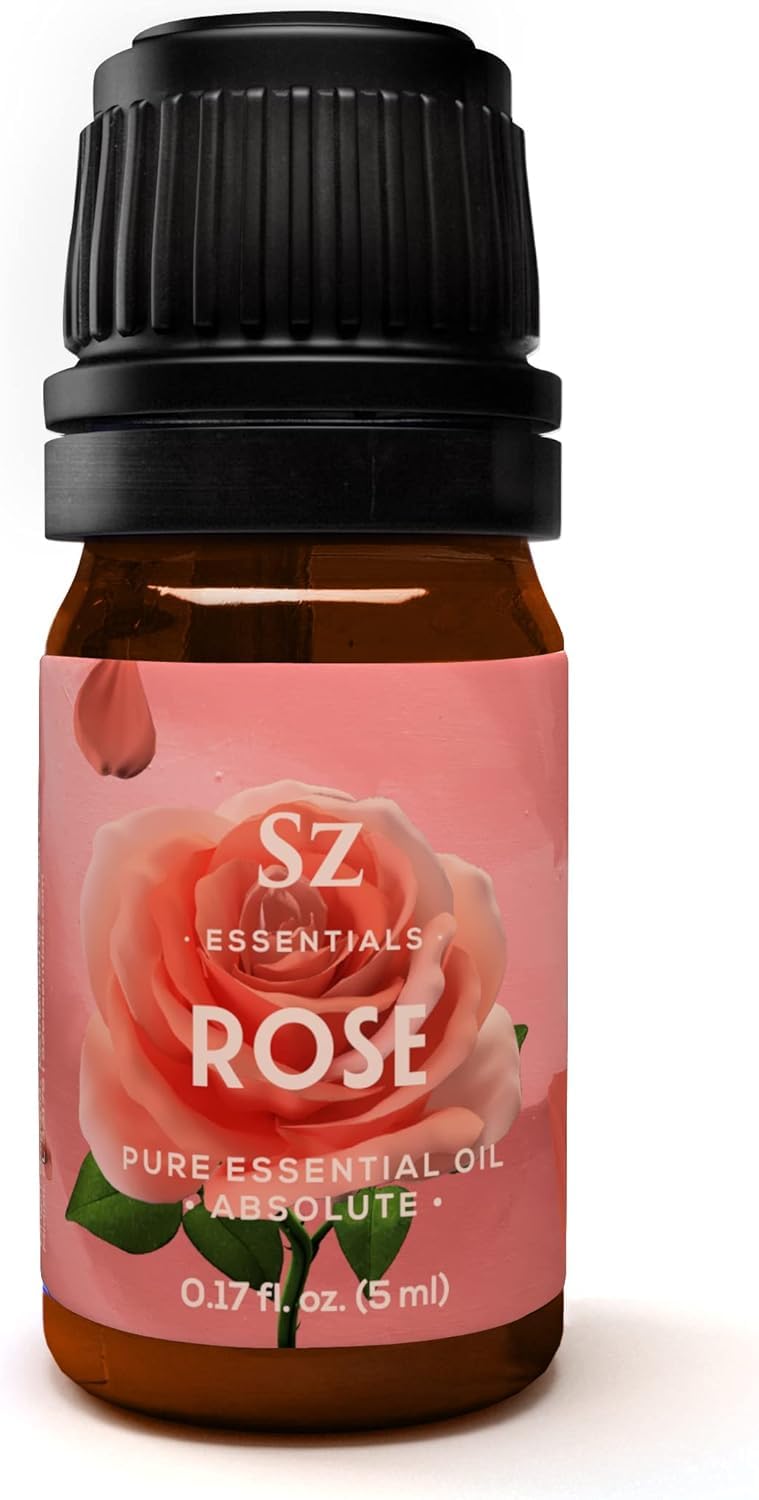 Sz Essentials Rose Absolute oil bottle being poured to evoke a calming spa atmosphere.