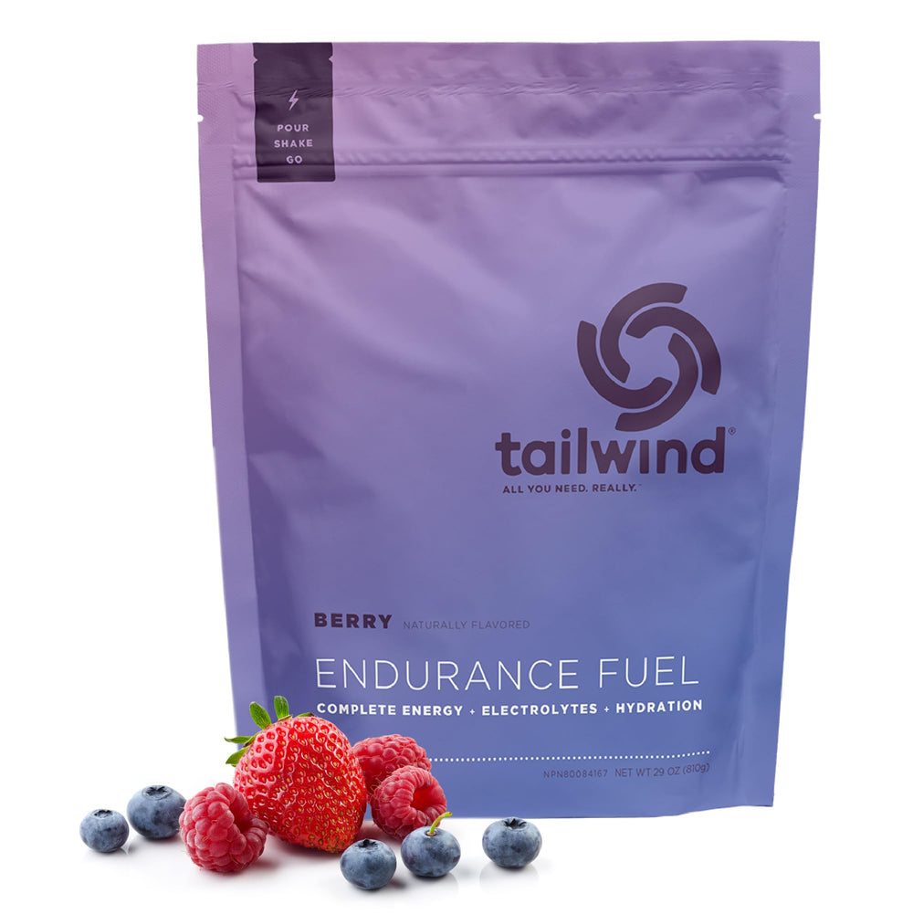 Tailwind Endurance Fuel bottle being poured for steady hydration during training.