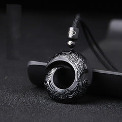 Tamhope Lucky Bird carved pendant close-up showcasing craftsmanship.